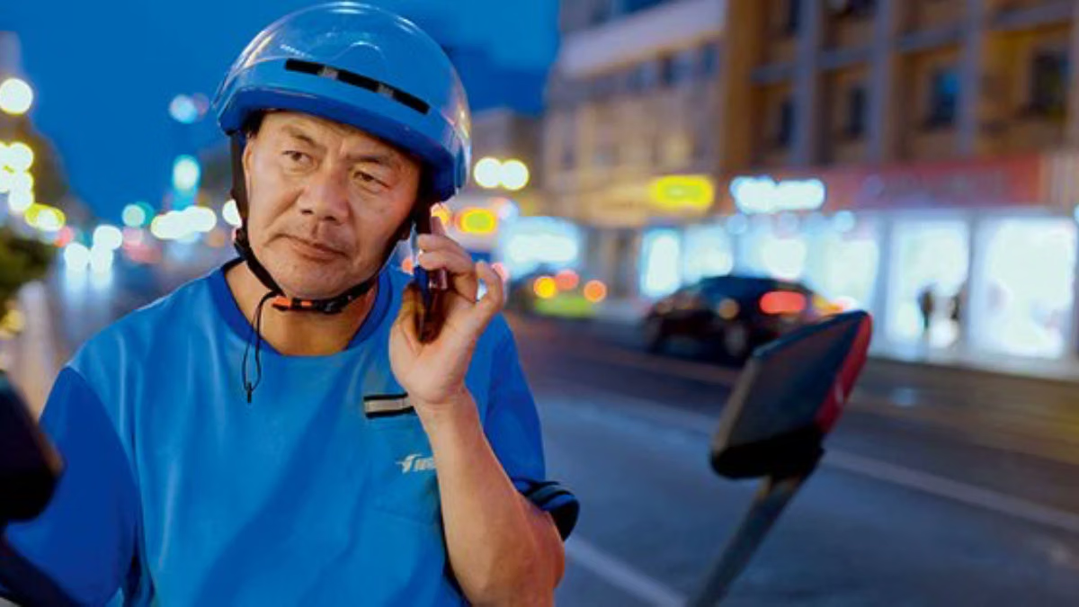 Chinese gig worker wins top literary prize. He writes on struggles of delivery riders